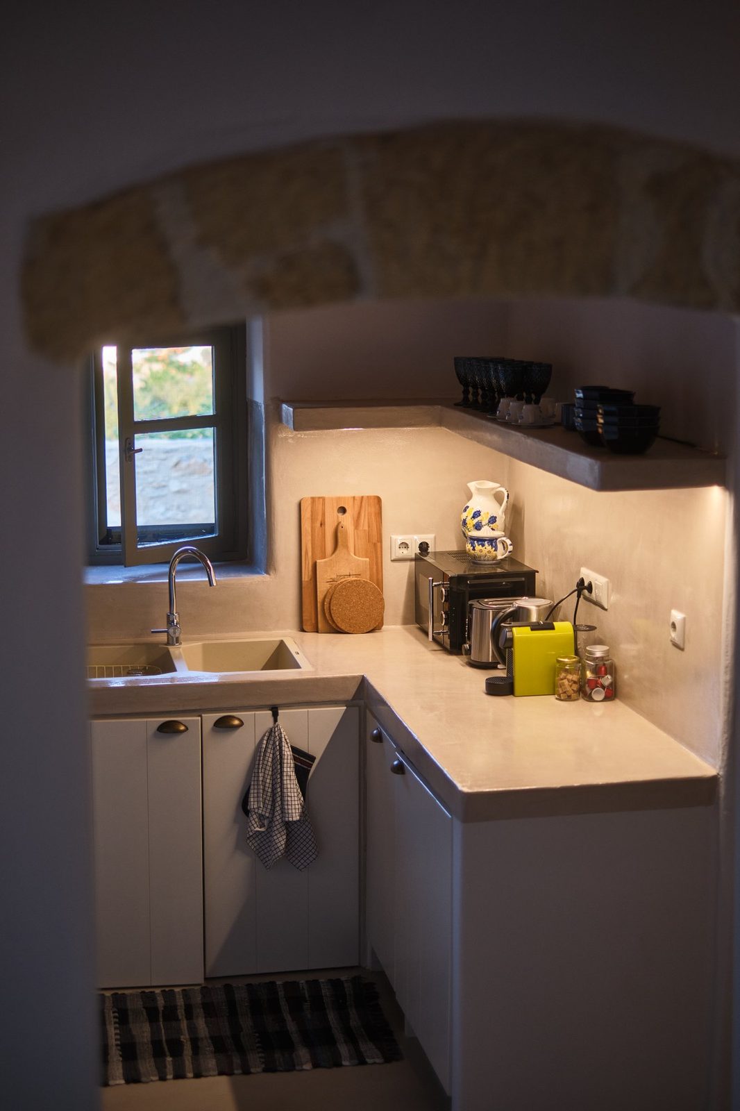 Kitchen through stone archway